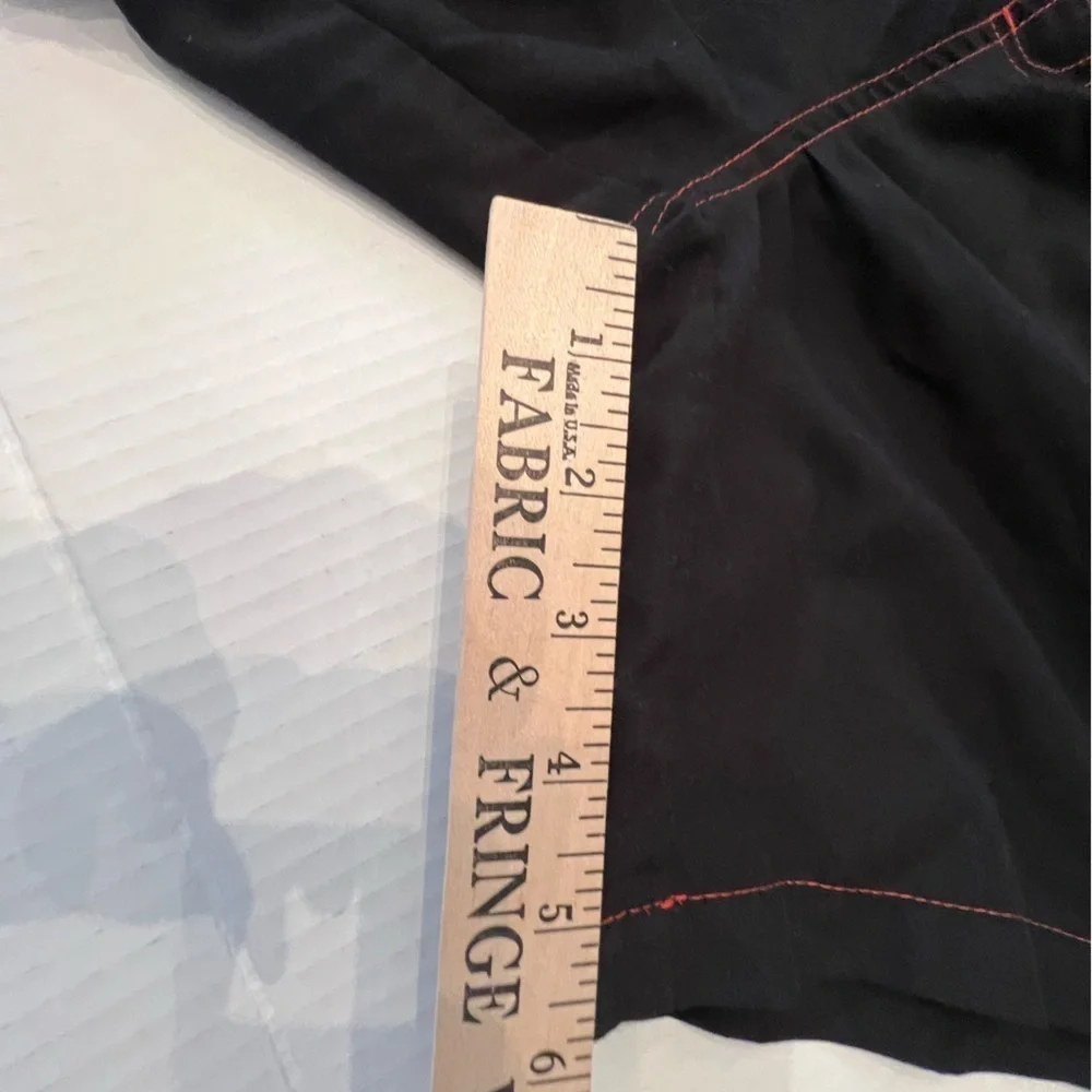 CALVIN KLEIN MENS SWIM TRUNKS. SIZE MEDIUM. BLACK WITH ORANGE STITCHING